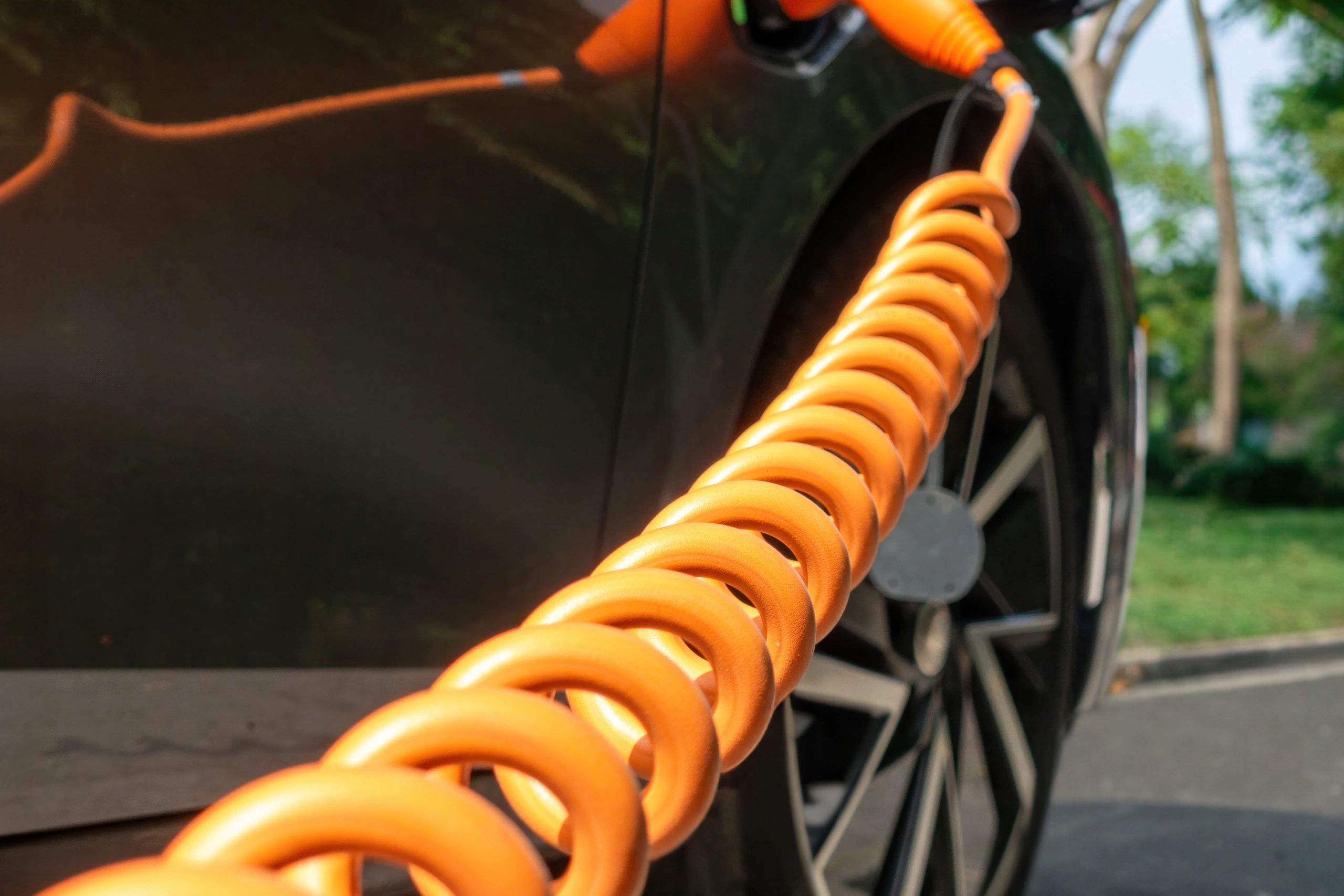 Electric vehicle charging cable connected during charging